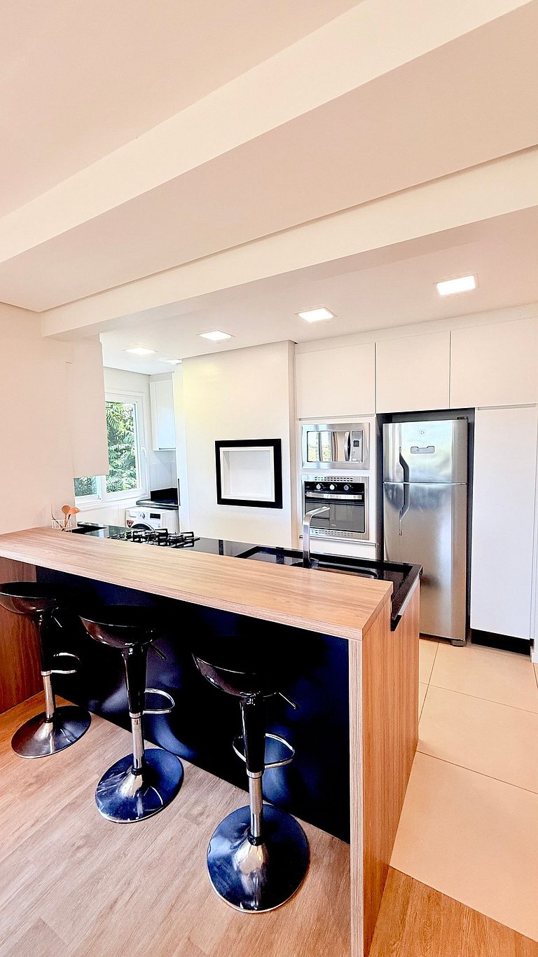 2 Suítes • Vista Sunset • 5min Centro