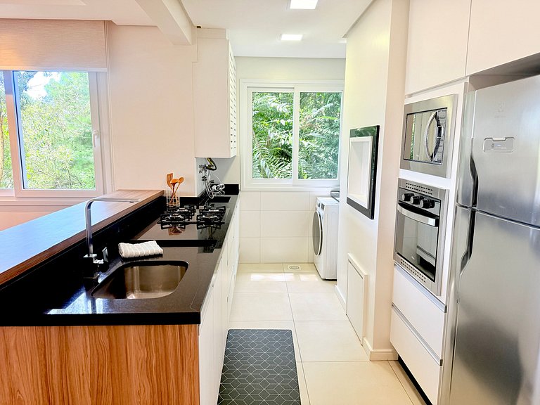 2 Suítes • Vista Sunset • 5min Centro